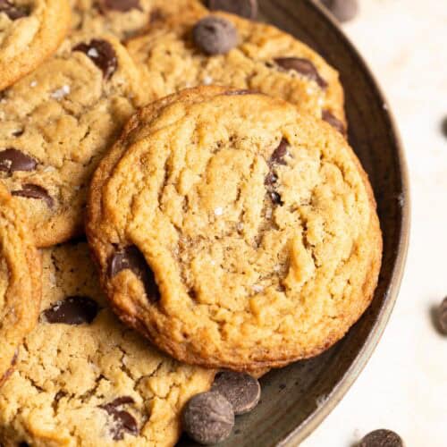 Sourdough chocolate chip cookies on a ceramic plate.