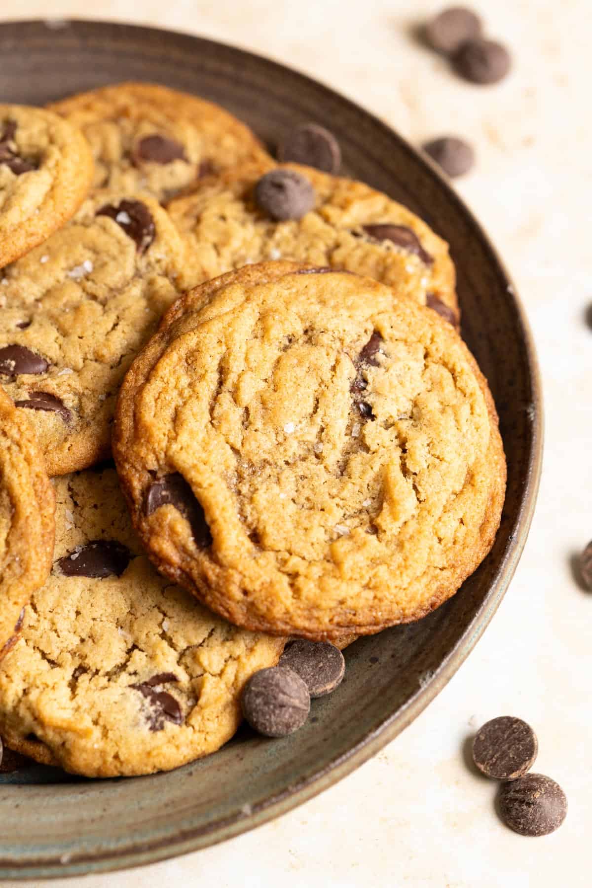 Sourdough chocolate chip cookies on a ceramic plate.