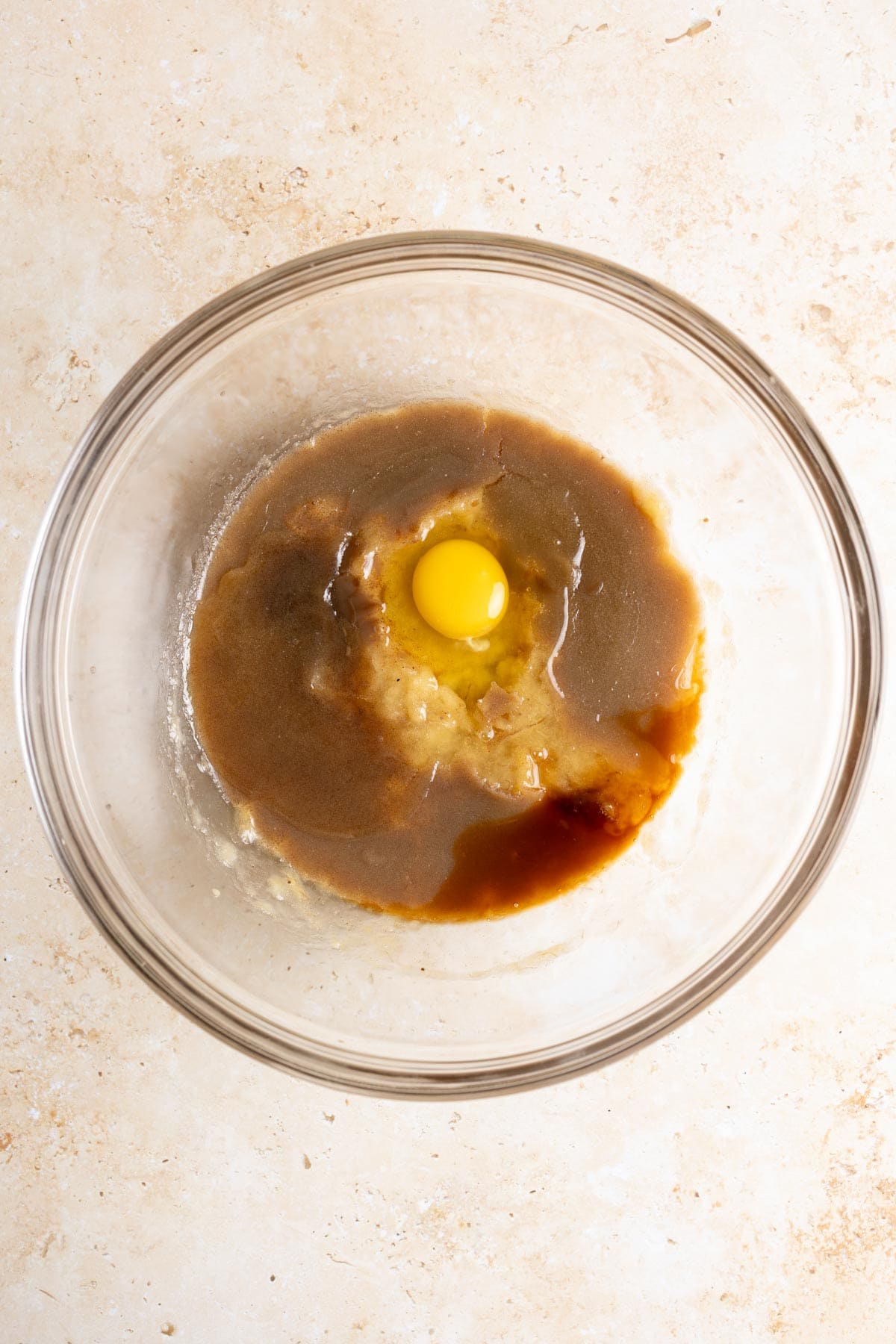 Mix wet ingredients together for sourdough banana bread batter.