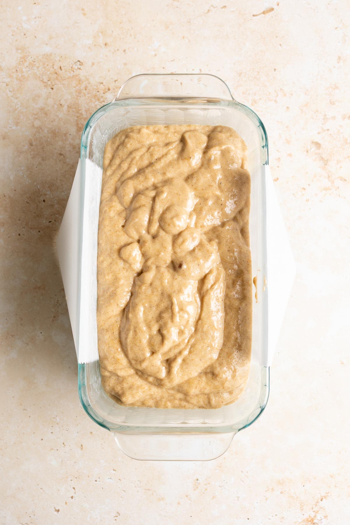 Sourdough banana bread batter in a loaf pan.
