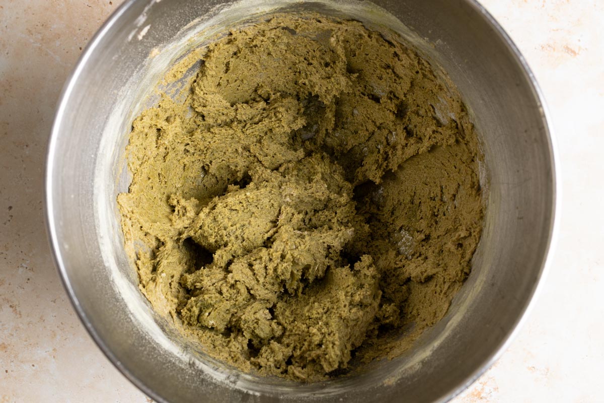 Matcha sourdough cookie dough in the mixing bowl.