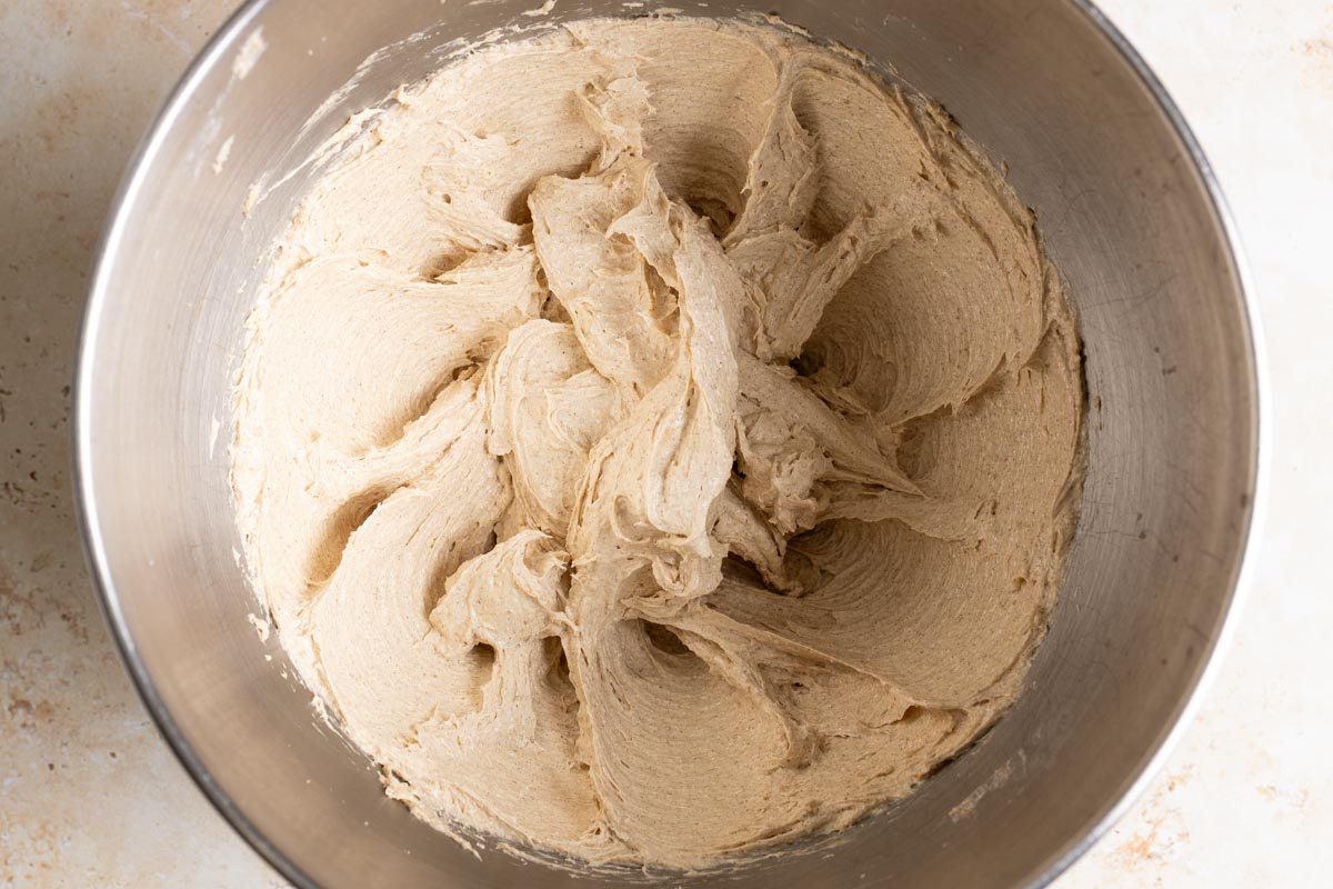 Creamed wet ingredients in a metal mixing bowl.