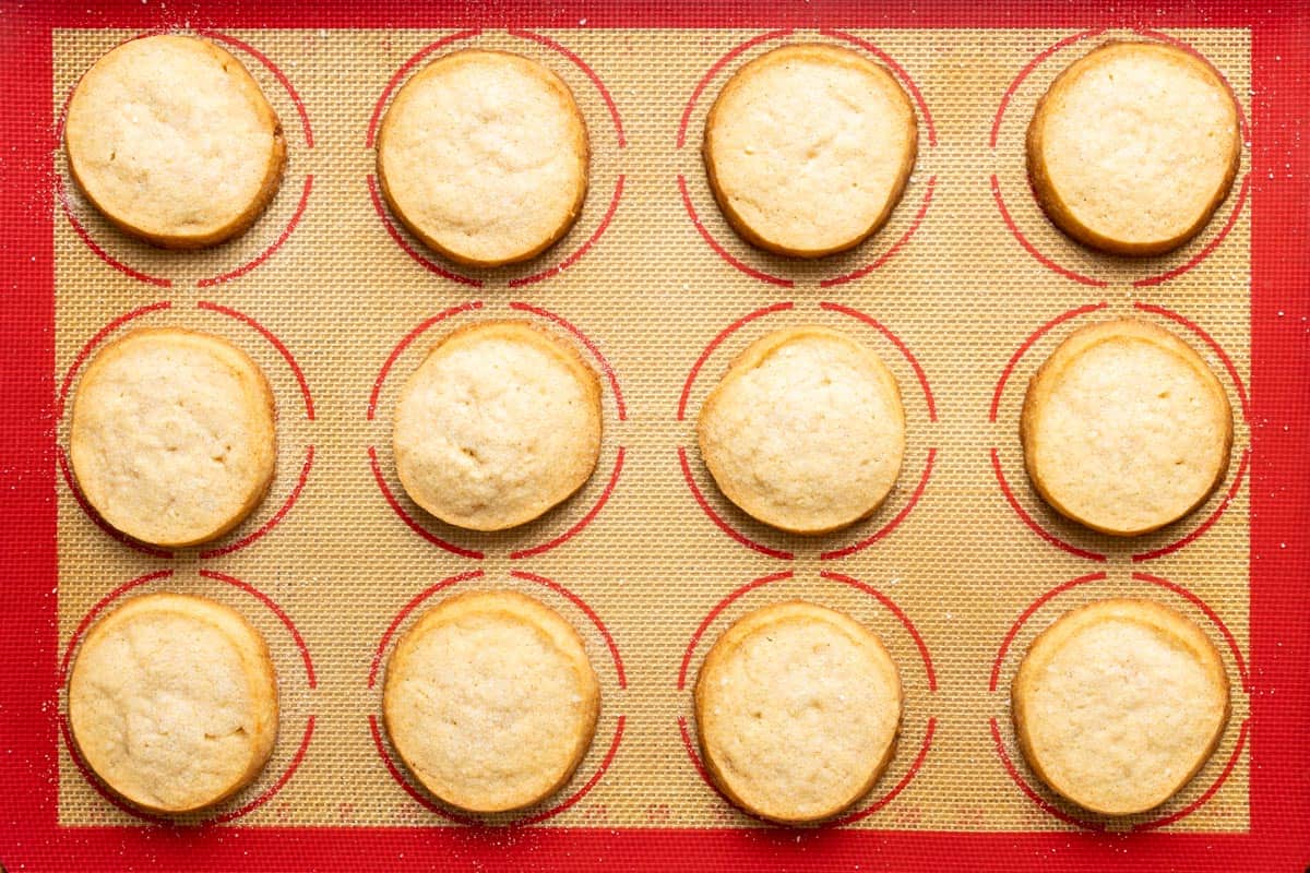 Baked sourdough shortbread cookies on a tray.