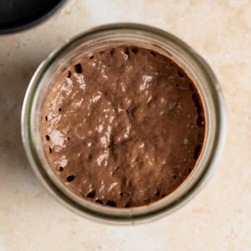 Top down view of chocolate starter in a jar.