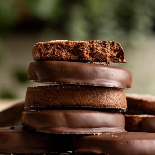 A stack of chocolate covered sourdough chocolate shortbread cookies.