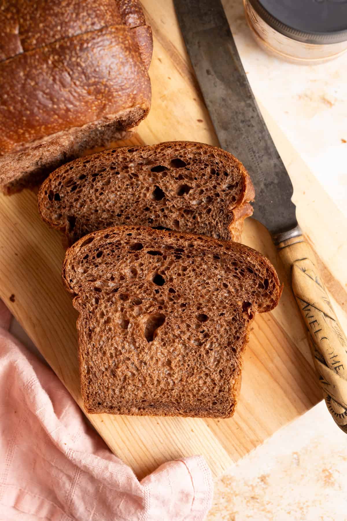 2 slices of sourdough chocolate milk bread on a cutting board.