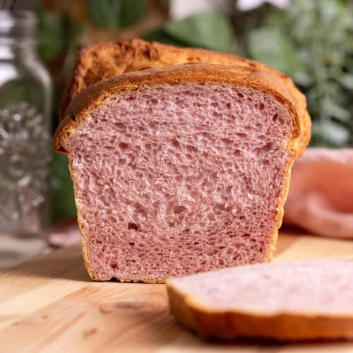 The interior of a loaf of sourdough purple sweet potato milk bread.