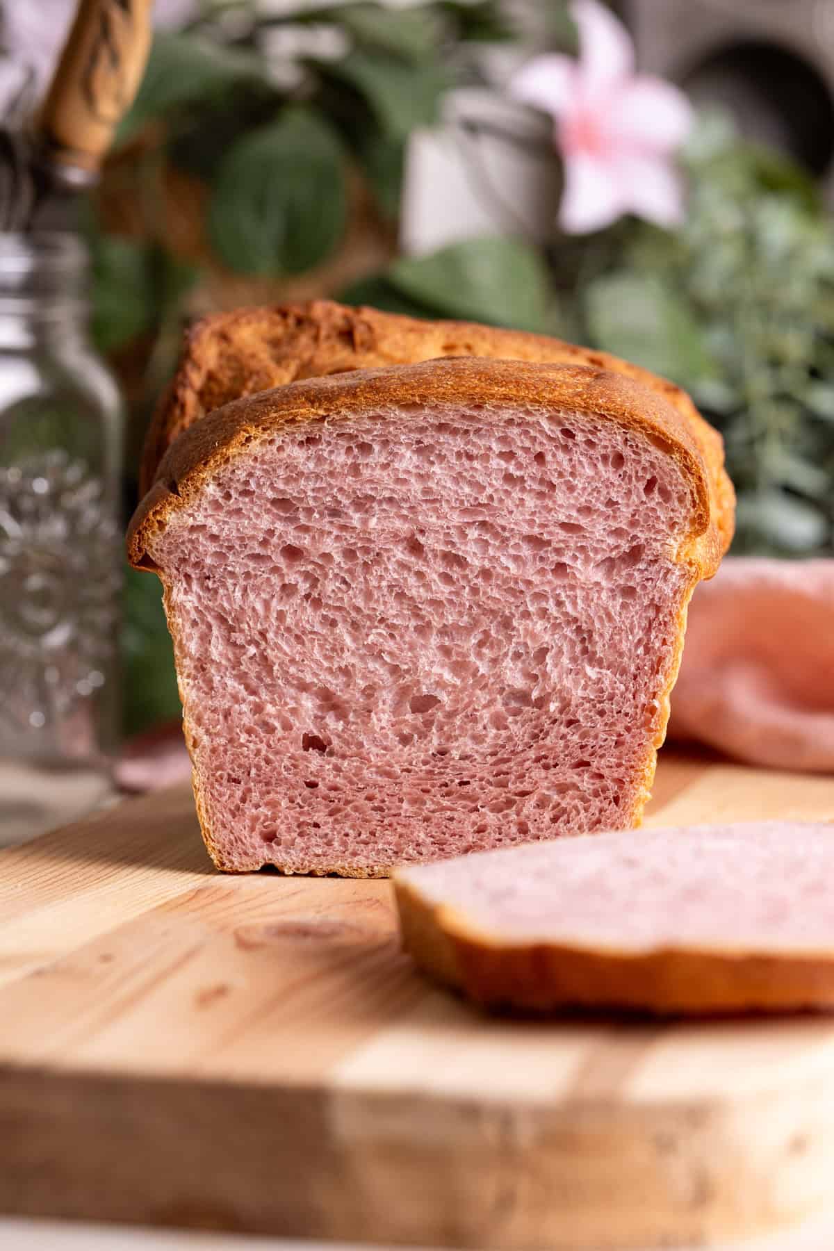 The interior of a loaf of sourdough purple sweet potato milk bread.