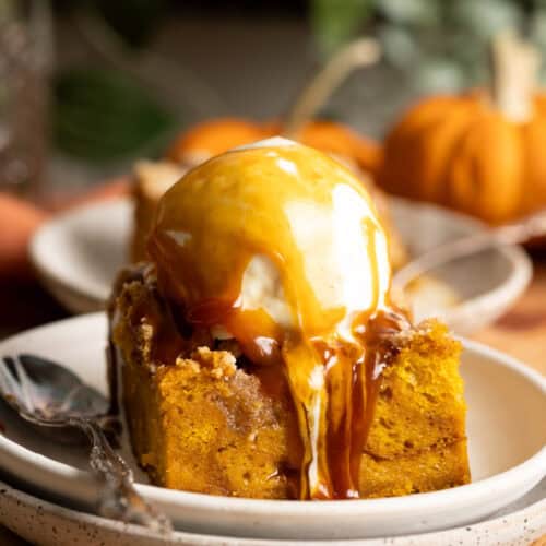 Pumpkin bread pudding with vanilla ice cream and miso caramel running down the side.